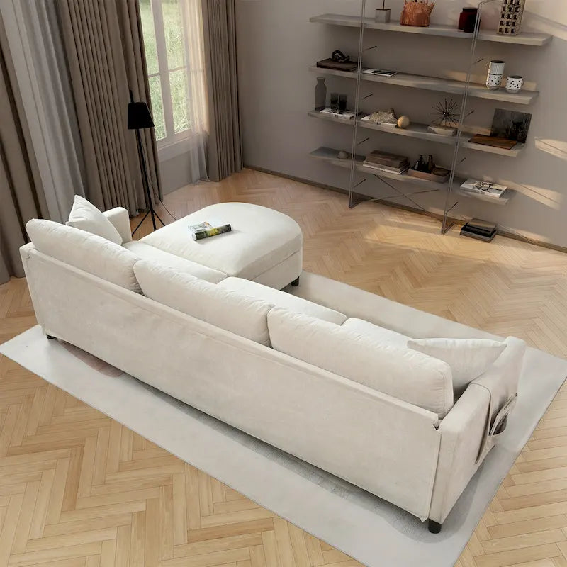 Divano a 4 posti in tessuto beige con pouf mobile
